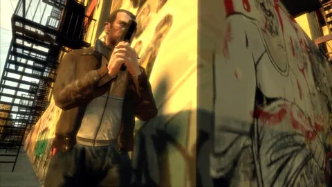 Niko leans around a corner with his gun ready to fire.