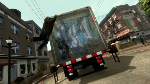 Niko hangs onto a truck
