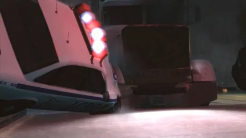 A cop car hits a truck.