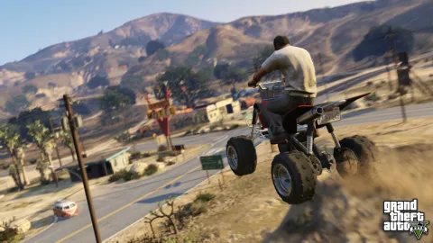 Trevor launches off a hill on a quad