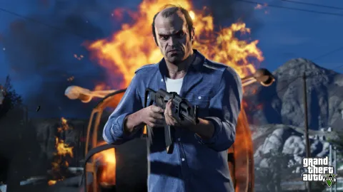Trevor steps away from a burning helicopter