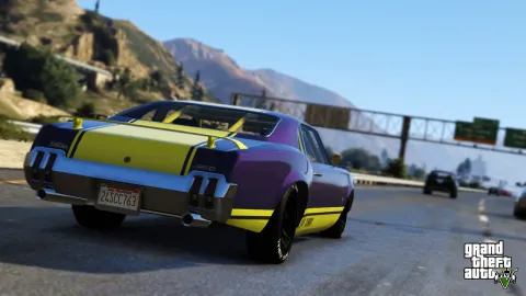 A vibrant Sabre GT on a countryside freeway