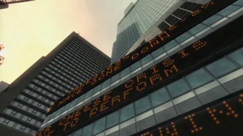 The news and stocks scroll past.