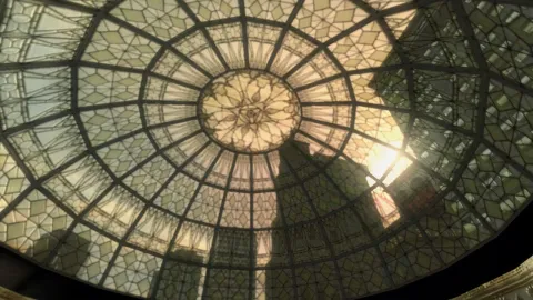 The light shines through a patterned glass roof.