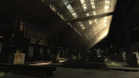 The sunlight brightens a dark warehouse.