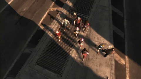 Pedestrians seem drawn to the light.
