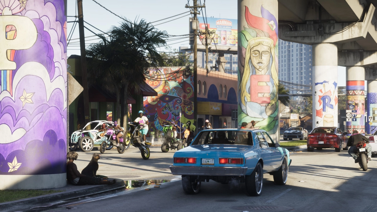 A road in Vice City where cars are driving and people on dirt bikes and ATVs are performing tricks. A road in Vice City where cars are driving and people on dirt bikes and ATVs are performing tricks.