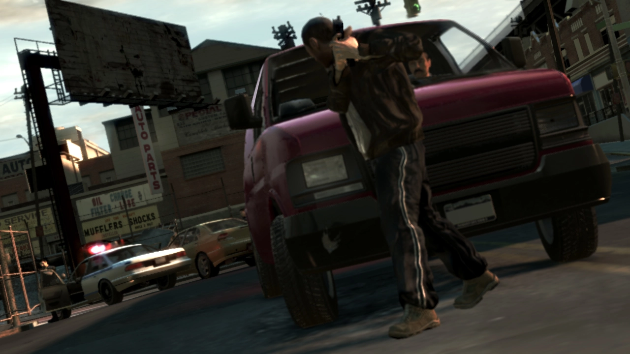 Niko uses a car as cover