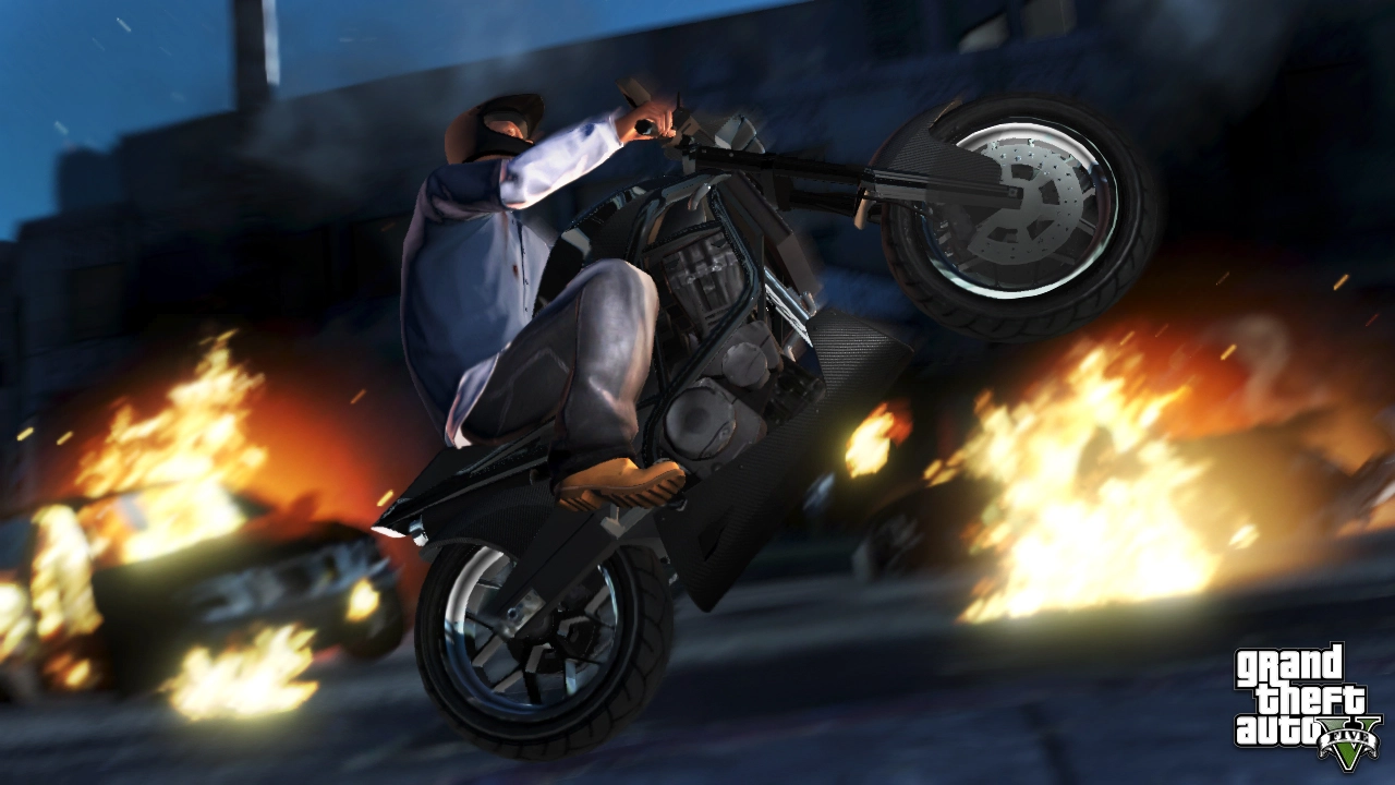 Franklin doing wheelies past burning cars