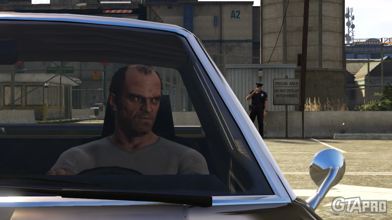 Trevor waits outside the prison