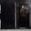 Niko standing in a doorway.