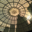 The light shines through a patterned glass roof.
