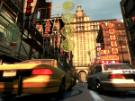 A taxi and police car travel through China Town.