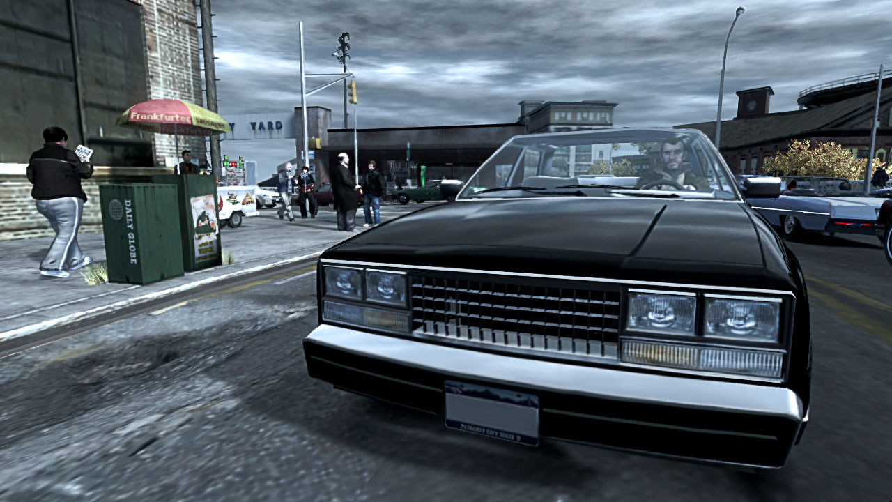 Niko drives a black vehicle while the sky above is dark and grey.