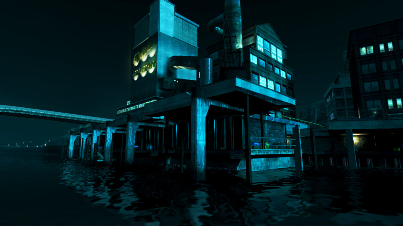 A beautifully lit building on the water at night.