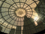 The light shines through a patterned glass roof.