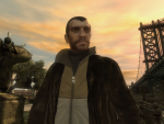 The main character Niko Bellic stands in a park.